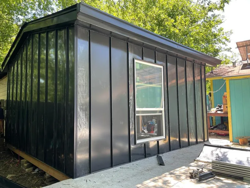 Black standing seam metal wall panels for Roof Inspection in Cheshire